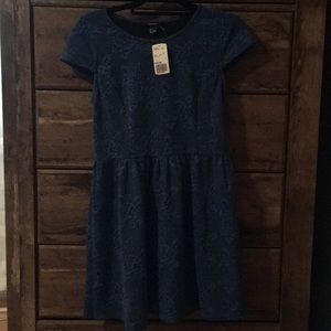 A blue cap sleeve dress with a skater skirt